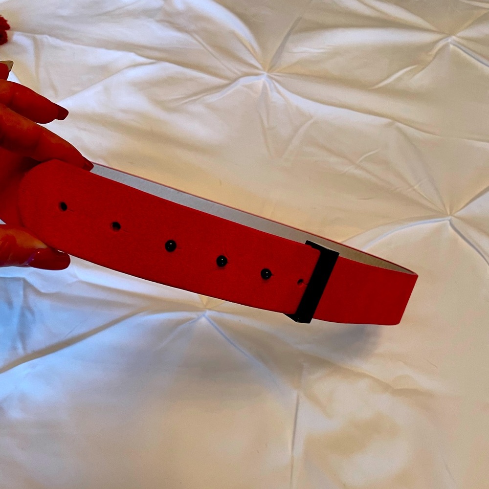 Hot pink suade belt. 2” thick. Size M. Black accents.